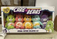 Front view of Care Bears Special Edition Collector Set box with 5 bears visible in window packaging, including exclusive Do-Your-Best Bear.