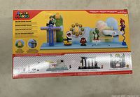 Photo of the back of the box showing the playset components and layout.
