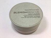 Top view of closed bareMinerals Blemish Rescue Skin-Clearing Loose Powder Foundation container showing label on silver lid.