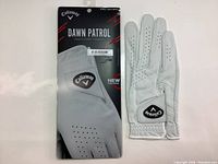 Front view of new Callaway Dawn Patrol golf glove with packaging showing size and brand details.