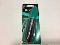 Front view of new Revlon Super Length mascara in original packaging, black tube with teal cap visible with product information and branding.
