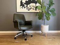 front-left angled view of olive green leather chair with aluminum base and casters on hardwood floor