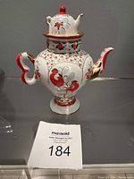 Overall view of Russian porcelain brewing teapot showing handle, spout, and decoration.