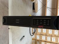 Front view of APC Smart-UPS 3000 front panel showing branding and model.
