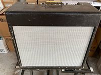 Front view of amplifier showing black Tolex covering and grey grille cloth