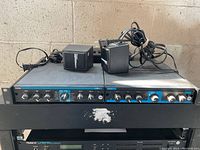 Two Lexicon rack units side by side, power adapters on top