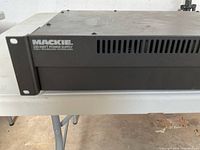 Side front view showing Mackie branding and ventilation slots