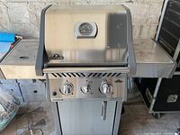 Full front view of Napoleon Rogue grill with side shelf