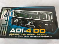 Top-down view of original box showing front panel image and model name ADI-4 DD