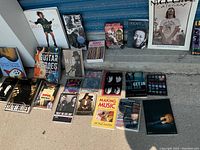 Overview of collection including books, cassette tapes, calendars, and boxed sets with visible titles and cover images.