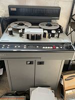 Full front view of recorder with cabinet and mounted VU meter/display