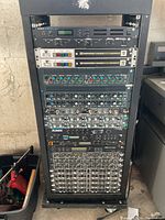Full frontal view of rack with all modules installed, showing overall configuration and wear.