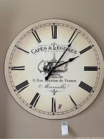 Front view of the 36 inch Cafes & Legumes wall clock, showing face, numerals, hands, and central teapot graphic.