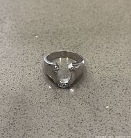 Front view of ring showing raised horseshoe motif