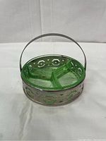 Green Depression glass relish dish with three compartments inside a silver plated basket with handle.