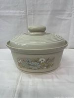 Front view of Royal Doulton Florinda lidded casserole dish showing floral pattern on side and ribbed lid with knob handle.