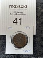 Photo showing the coin in a protective sleeve with handwritten note indicating 'PEI 1871 1 cent.'