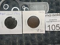 Two Canadian one cent coins from 1901 and 1903 shown side by side in coin holders with VF30 condition markings.