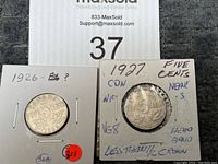 Photo showing two Canadian nickels in holders marked with lot number 37 and some seller notes.