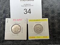 Both 1932 and 1933 Canadian 5 cent coins in individual holders for display and protection.
