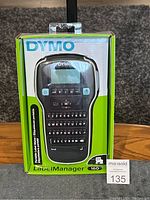Front view of the Dymo LabelManager 160 label maker in retail box packaging showing product image and branding.