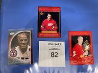 Three Gordie Howe collectible hockey cards including Hall of Fame Showcase, Legends Classics, and Upper Deck Heroes.