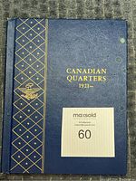 Front cover of blue coin album titled 'Canadian Quarters 1921–'
