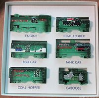 Full set of green glass Boyd's train cars in original box, all six pieces shown with front view.