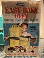 Photo of original Kenner Easy-Bake Oven box highlighting baking features and instructions.