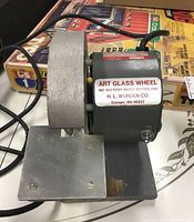 Front view showing entire art glass wheel assembly mounted on base with work rest