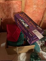 Boxes of Danson brand Halloween decorative string lights in original packaging, stacked with visible product branding and item count (10 lights per box).