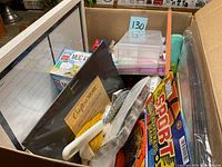 Box contents showing various craft supplies, storage boxes, and coffee package