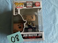Front view of Jam Master Jay POP! Rocks vinyl figure box showing figure and branding.
