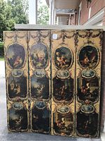 Full front view of four-panel leather folding screen with painted Rococo cartouches.