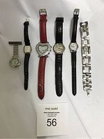 Full lot shot showing all six watches with different styles and bands.