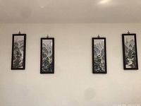 All four framed porcelain landscape panels hung on wall