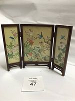 Front side of small wooden folding screen with three panels, painted birds and flowers