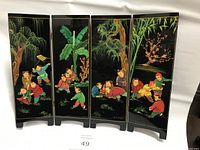Front side of the folding screen showing colorful paintings of children playing among trees and flowers.