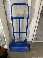 Blue metal hand truck/dolly showing tall handle and base plate