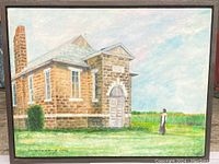 Photo of framed painting showing a stone building and a figure in a rural field under a partly cloudy sky, signed and dated by Douglas Laing 2006.