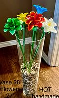 Front view of the five colorful handmade glass flowers and tall clear vase filled with polished stones, highlighting size with text overlay.