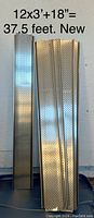 Photo showing multiple aluminum gutter guard pieces arranged vertically against a wall with text indicating size and condition (12x3ft +18inches = 37.5 feet, new).