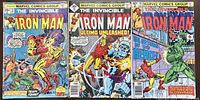Photo showing three vintage Iron Man comics from Marvel Comics Group, with colorful covers featuring Iron Man in action scenes.