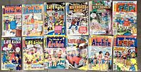 Photo showing 13 vintage Archie comic books arranged in two rows, with various titles including Archie Me, Life with Archie, Archie Riverdale High, and PEP, featuring colorful vintage cover art.