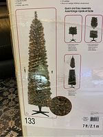 Box images showing the front and side of the packaging with tree image, dimensions, SKU, and assembly instructions.