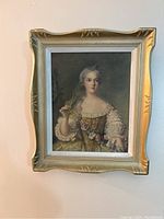 Framed oil paint print of Sophie of France with a gold decorative vintage frame hung on a wall.