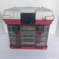 Front view of the plastic storage case showing clear front drawers and exterior colors.