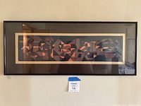 Full view of framed horizontal abstract geometric art print hung on wall.