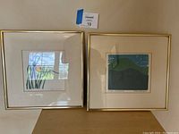 Pair of framed wall art prints displayed side by side, showing overall size and framing style.