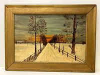 Framed oil painting showing the entire artwork depicting a winter country road with trees and a sunset sky.